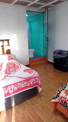 Postel nebo postele na pokoji v ubytování Rancho los Alebrijes Zacatlan