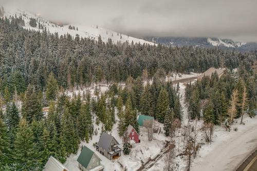an aerial view of a snow covered mountain with trees at Snoqualmie Pass Cabin with Deck Walk to Ski Lift in Snoqualmie Pass