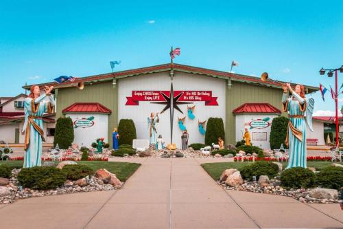 a building with a christmas display in front of it at The Frankenmuth Christmas Wonderland House - Hot in Birch Run