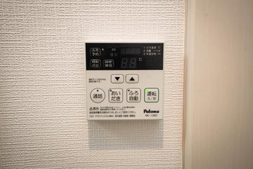 a close up of an electronic device on a wall at shinjuku1 in Tokyo