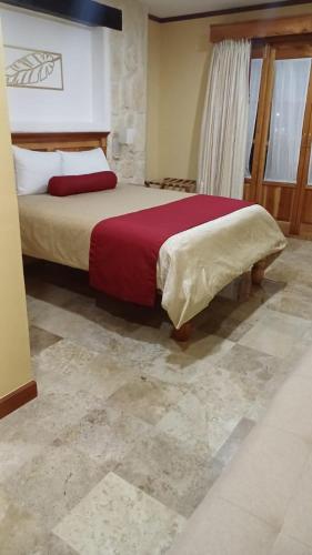 Katil atau katil-katil dalam bilik di Cancun International Suites