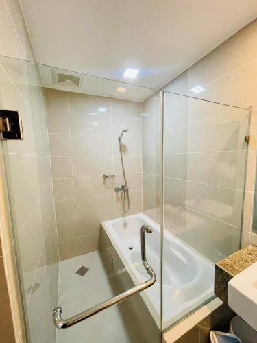a bathroom with a shower and a glass shower backdoor at Mactan Newtown Rental by EJB in Punta Engaño