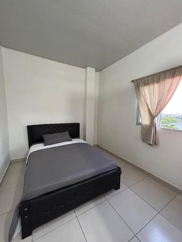 a bed in a white room with a window at ARMANI in Puerto Colombia