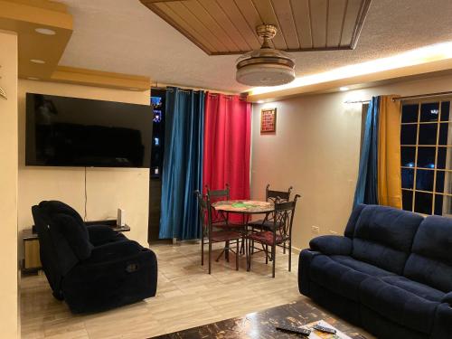 a living room with a couch and a table at Sunset condos getaway In Ocho Rios in Ocho Rios