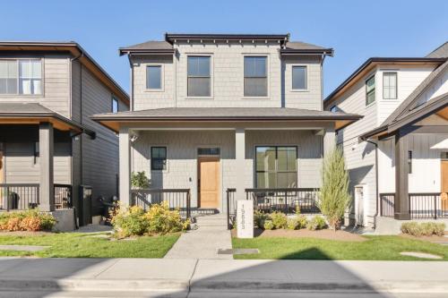 a house with a gate in front of it at Sparsh Villas - Glamorous & Luxurious Family Home in Langley
