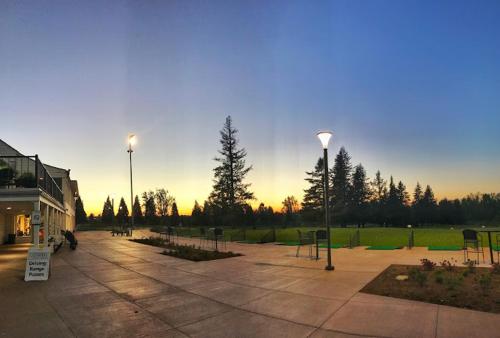 a parking lot with two street lights in a park at Country Inn & Suites by Radisson, Portland International Airport, OR in Portland