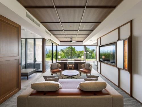 a living room with a couch and a table at GOTO RETREAT by Onko Chishin in Goto