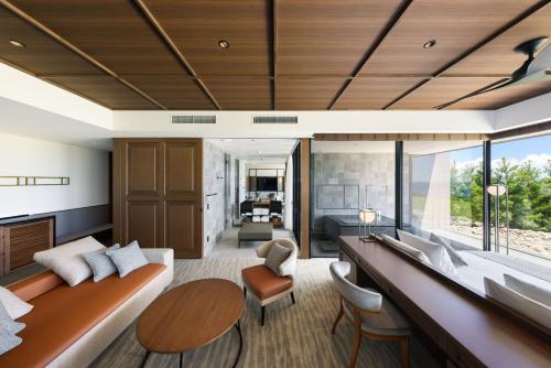 a living room with a couch and a table at GOTO RETREAT by Onko Chishin in Goto