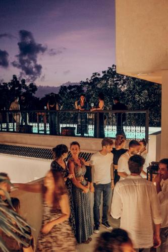 a group of people standing on top of a building at Yum Kaax Boutique Villa in Tulum