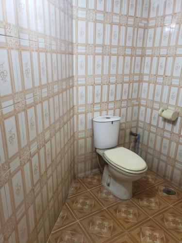 a bathroom with a toilet in a room at Private double room with attached bathroom nikunja 2 in Dhaka