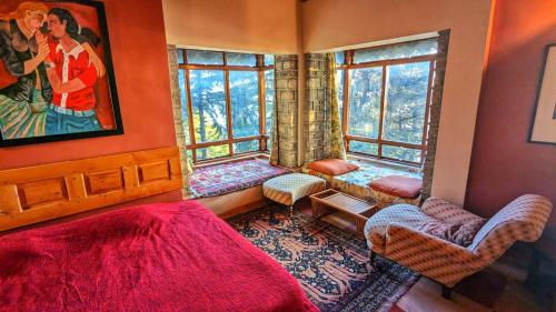a bedroom with a bed and two windows at Mountain View 3bhk Near Mall Road Deodar Retreat in Dalhousie
