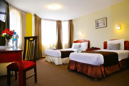 Ένα ή περισσότερα κρεβάτια σε δωμάτιο στο Hoteles Riviera Cayma