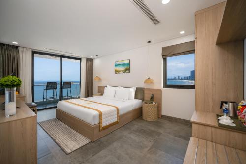 a hotel room with a bed and a balcony at Nguyen Gia Hotel in Danang