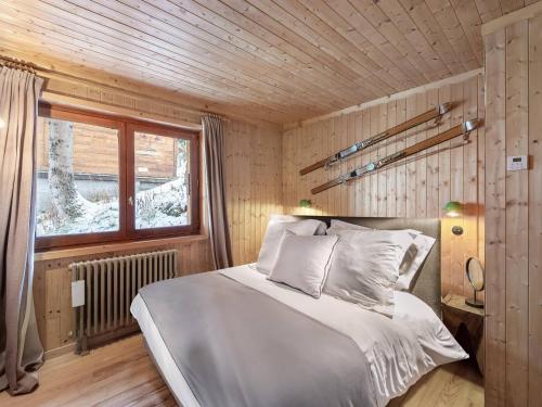 Кровать или кровати в номере Chalet Courchevel 1850, 4 pièces, 4 personnes - FR-1-564-97