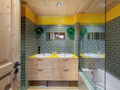 a bathroom with two sinks and a tub at Chalet Courchevel 1850, 4 pièces, 4 personnes - FR-1-564-97 in Courchevel