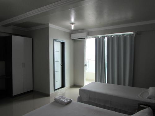 Кровать или кровати в номере Tapajós Center Hotel