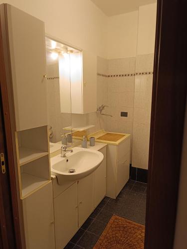 a bathroom with a sink and a mirror at Cà Savoia in Bologna