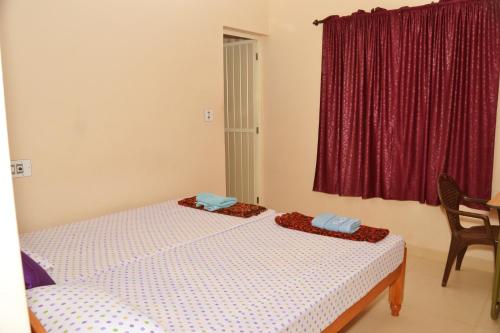 Postel nebo postele na pokoji v ubytování SHEEBA'S HOMESTAY