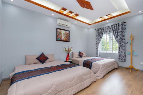 En eller flere senge i et værelse på Sala Pool Villa