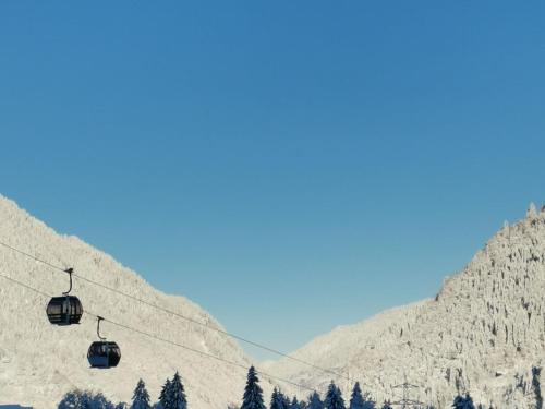 a ski lift going up a snowy mountain at Apartment in Vorarlberg near Ski Resort Montafon in Sankt Gallenkirch