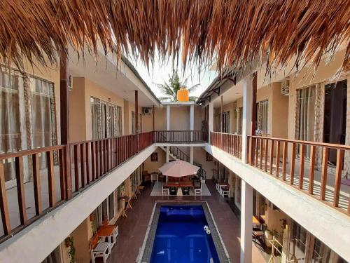 an overhead view of a building with a swimming pool at Gili Ilalang Village in Gili Trawangan