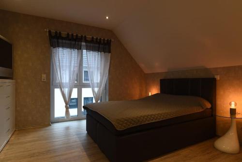 Katil atau katil-katil dalam bilik di Gemütliches Haus in der Wetterau