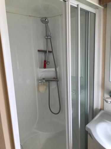 a shower in a bathroom with a glass shower stall at No 70 in Newton Stewart