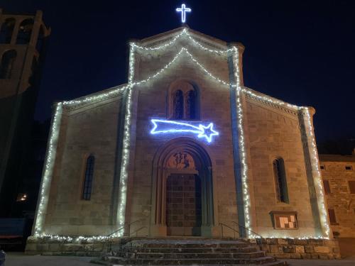 a church with lights on it at night at B & B Giu & Dany in Bruscoli