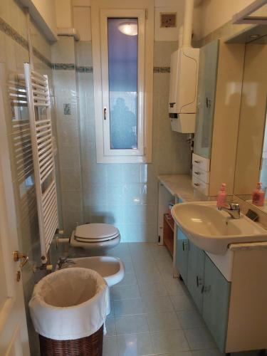 a bathroom with a toilet and a sink at Cà Del Dose in Venice