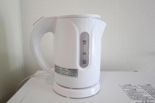 a white blender sitting on top of a counter at LUANA in SHIBUYA in Tokyo
