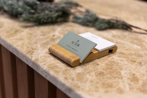 a book sitting on top of a table at Actor Hotel in Skopje