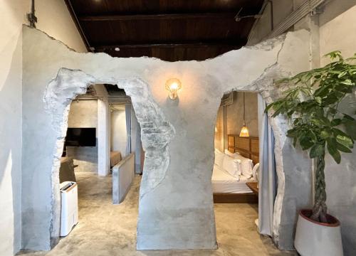 a hotel room with a wall covered in snow at Yu Apartment in Jiufen