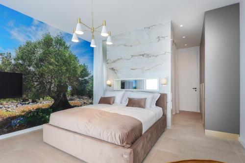 a bedroom with a large bed and a large window at Luxury villa del Sol in Novalja