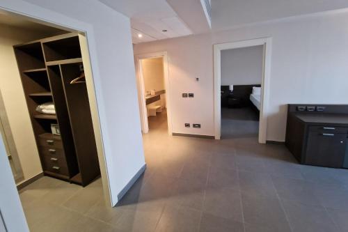 a room with a kitchen and a living room at Inn Naples Airport in Gricignano dʼAversa