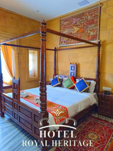 a bedroom with a four poster bed in a room at Hotel Royal Heritage in Jaisalmer