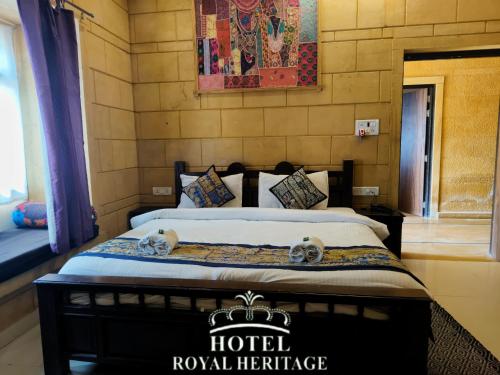 a hotel room with a bed with towels on it at Hotel Royal Heritage in Jaisalmer