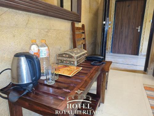 a wooden table with a television on top of it at Hotel Royal Heritage in Jaisalmer