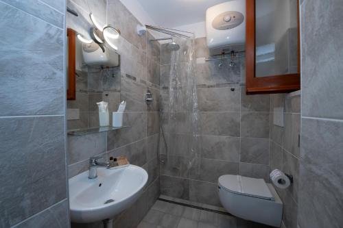 a bathroom with a sink and a toilet at Le Antiche Repubbliche Marinare in Amalfi