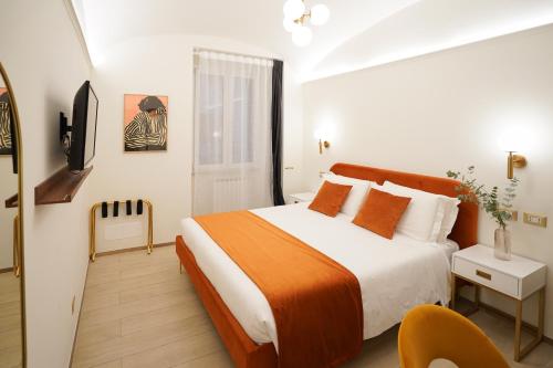 a bedroom with a bed and a television in it at Charm&Bella GuestHouse in Rome