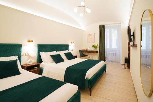 Postel nebo postele na pokoji v ubytování Charm&Bella GuestHouse
