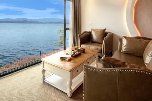 a living room with a view of the water at Dali Beauty Seaview B&B in Dali