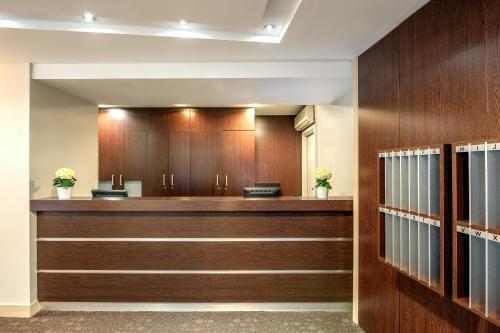 a court room with wood paneling and a bench at Citadines République Paris in Paris