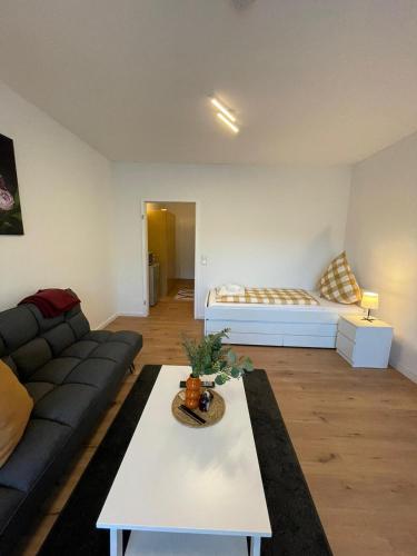 a living room with a couch and a table at Premium Apartment 1 in Pachten