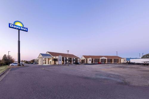 a street sign in front of a building at Days Inn by Wyndham Mooresville Lake Norman in Mooresville