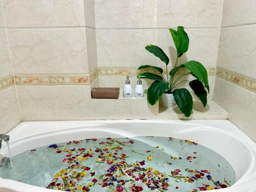 a bath tub filled with lots of sprinkles at Anh Thien Sai Gon Central Hotel - District 1 in Ho Chi Minh City