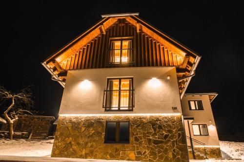 a house in the snow at night at Villa Seraf in Terchová