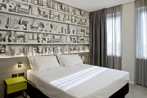 Postel nebo postele na pokoji v ubytování Hotel Friuli