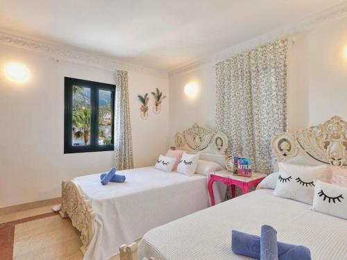 Säng eller sängar i ett rum på Marbella Villa Premium by Homing