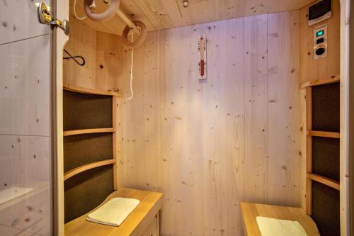 a room with wooden walls and shelves at Apartments Perfila Ferienchalet in Valdaora