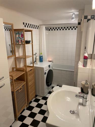 a bathroom with a sink and a toilet at Cute, Quiet and Central - Self Check In in Bad Ischl